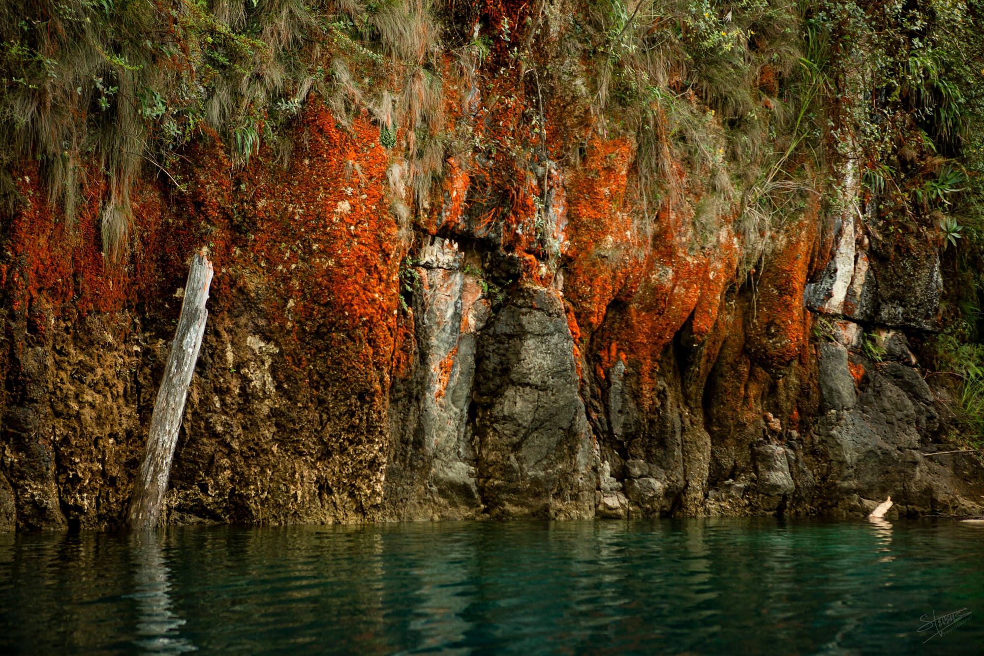 Orange mineral deposits on the bluffs at Lago Miramar.