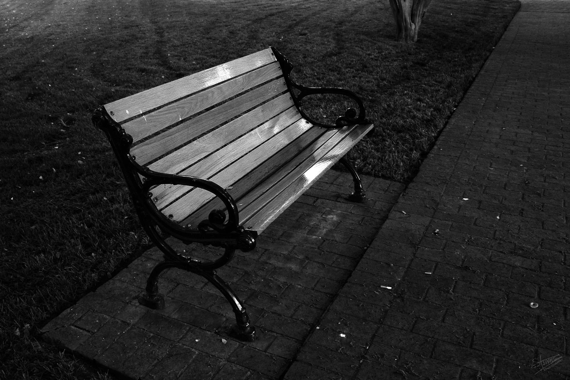 Park bench with wooden slats.