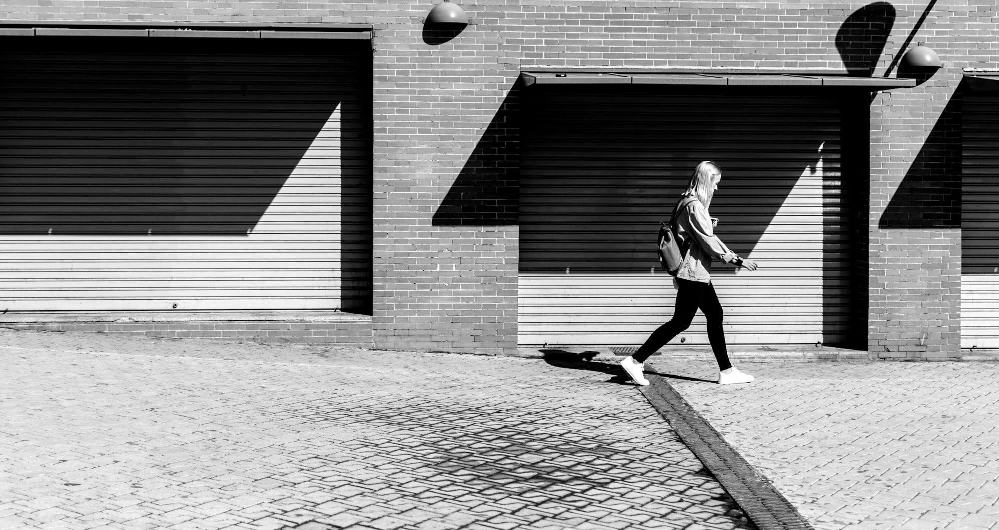 woman walking on running bone pavement