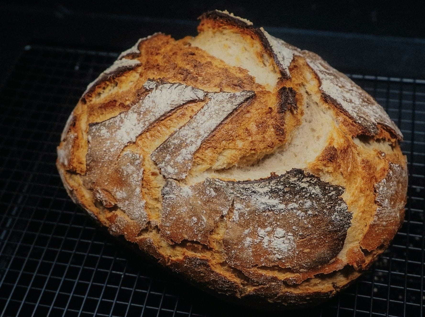 Freshly baked bread rests on a cooling rack.