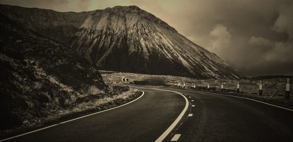 Rounding a bend in the road. Dangerous curve.