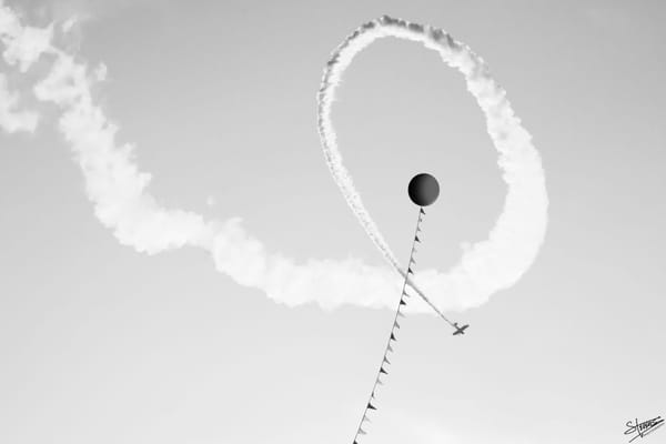 Biplane doing loopdie-loops and a big balloon on a long tether at Kaboomtown.