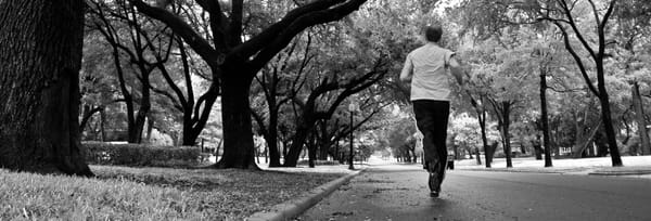 Runner on Swiss Avenue on a wet Sunday.