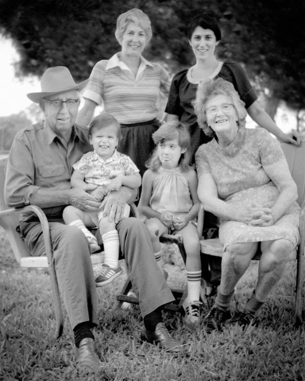 Lois with family and her ever-present smile.